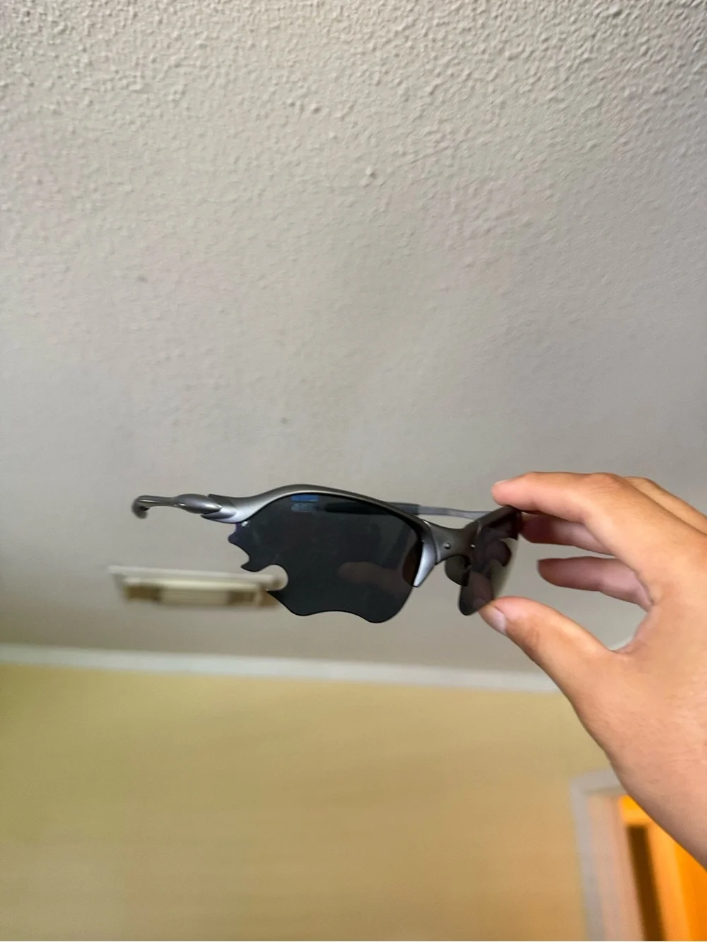 Silver Frame Sunglasses with Dark Lenses Oakley